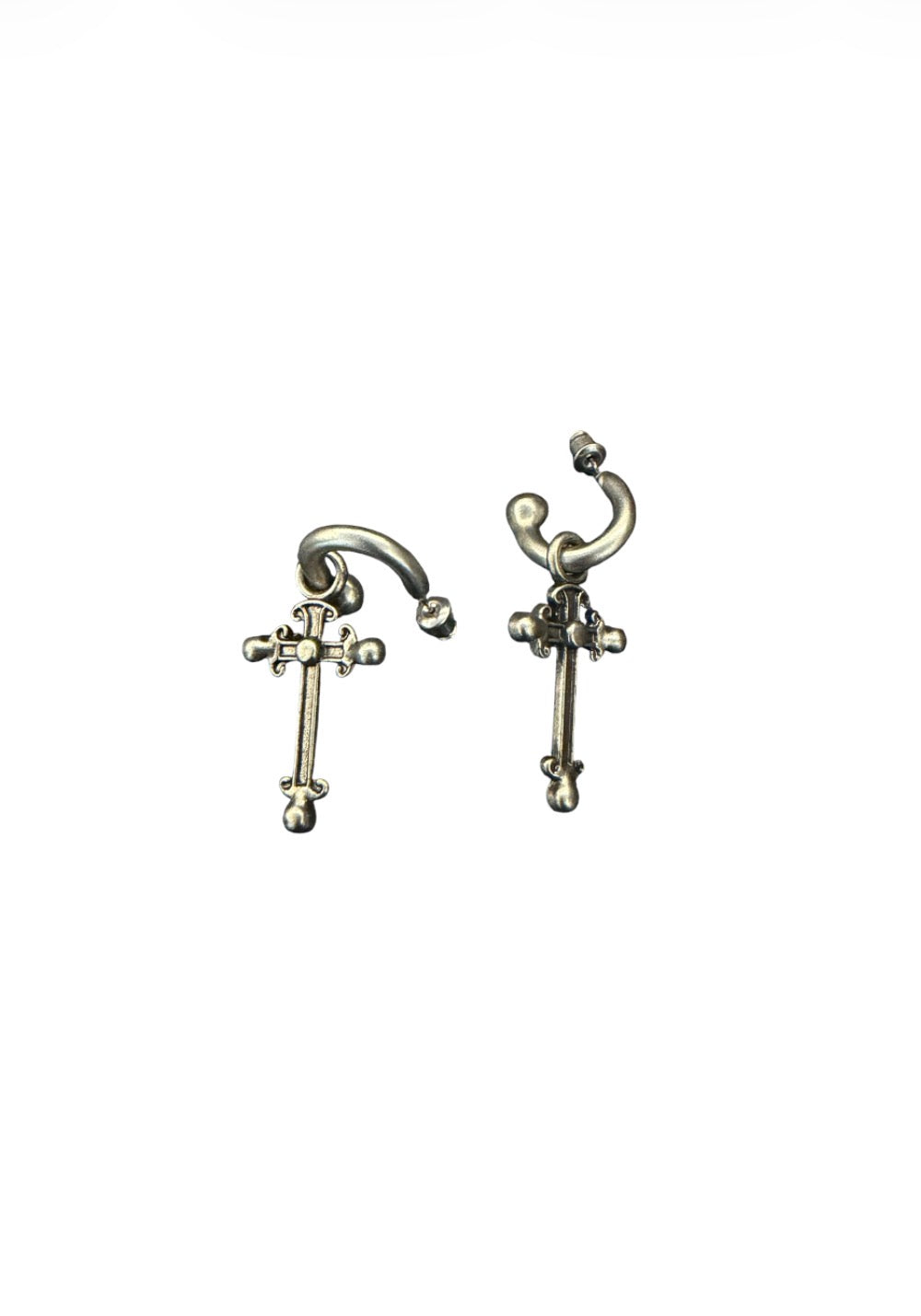 Silver-tone hoop earrings with ornate cross pendants