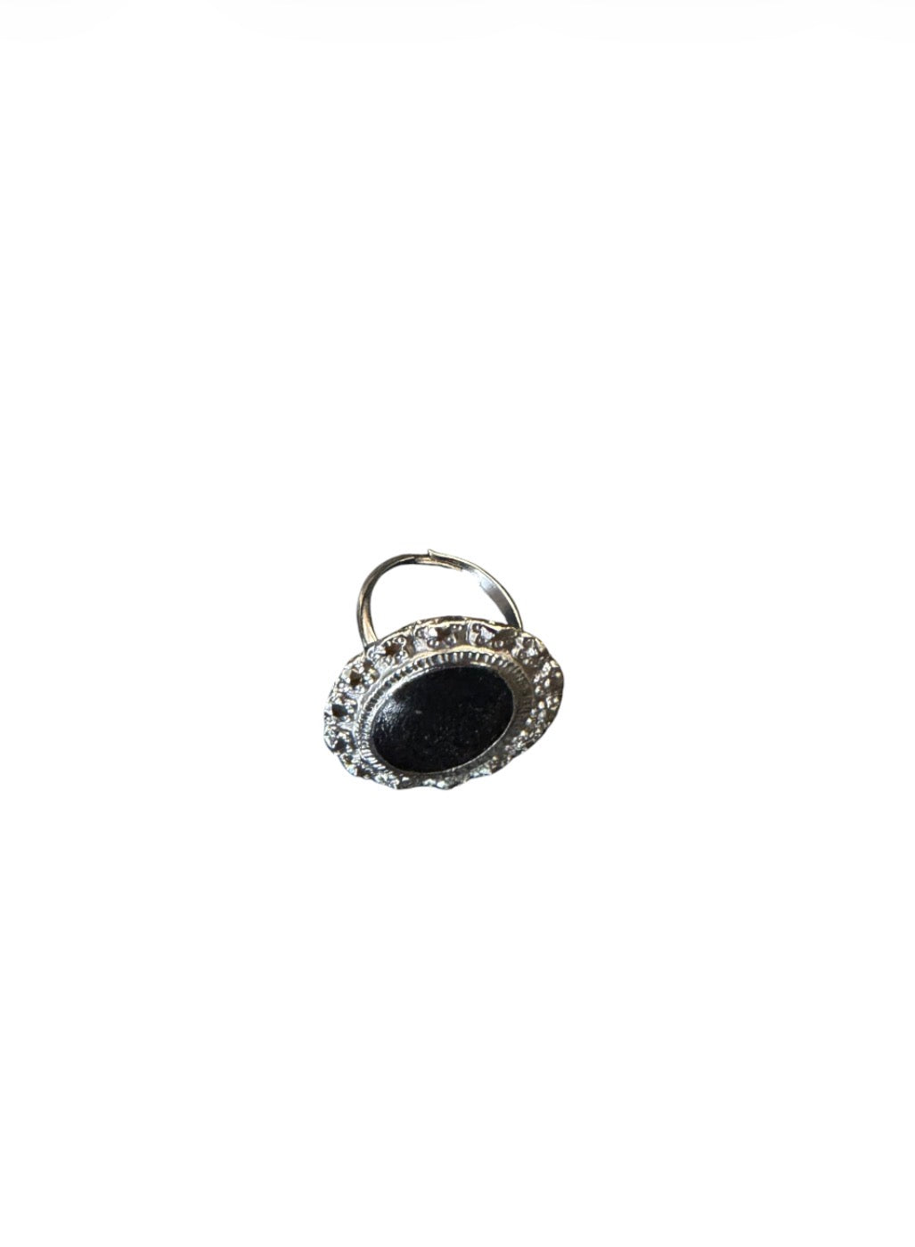 Silver-tone ring with an oval black centre and ornate border