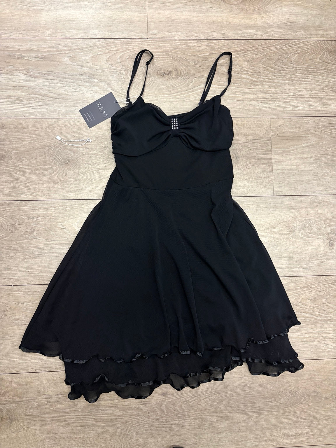 Black rhinestone layered ruffle dress front on white background