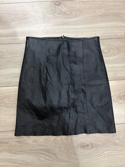 Black leather mini skirt front on white