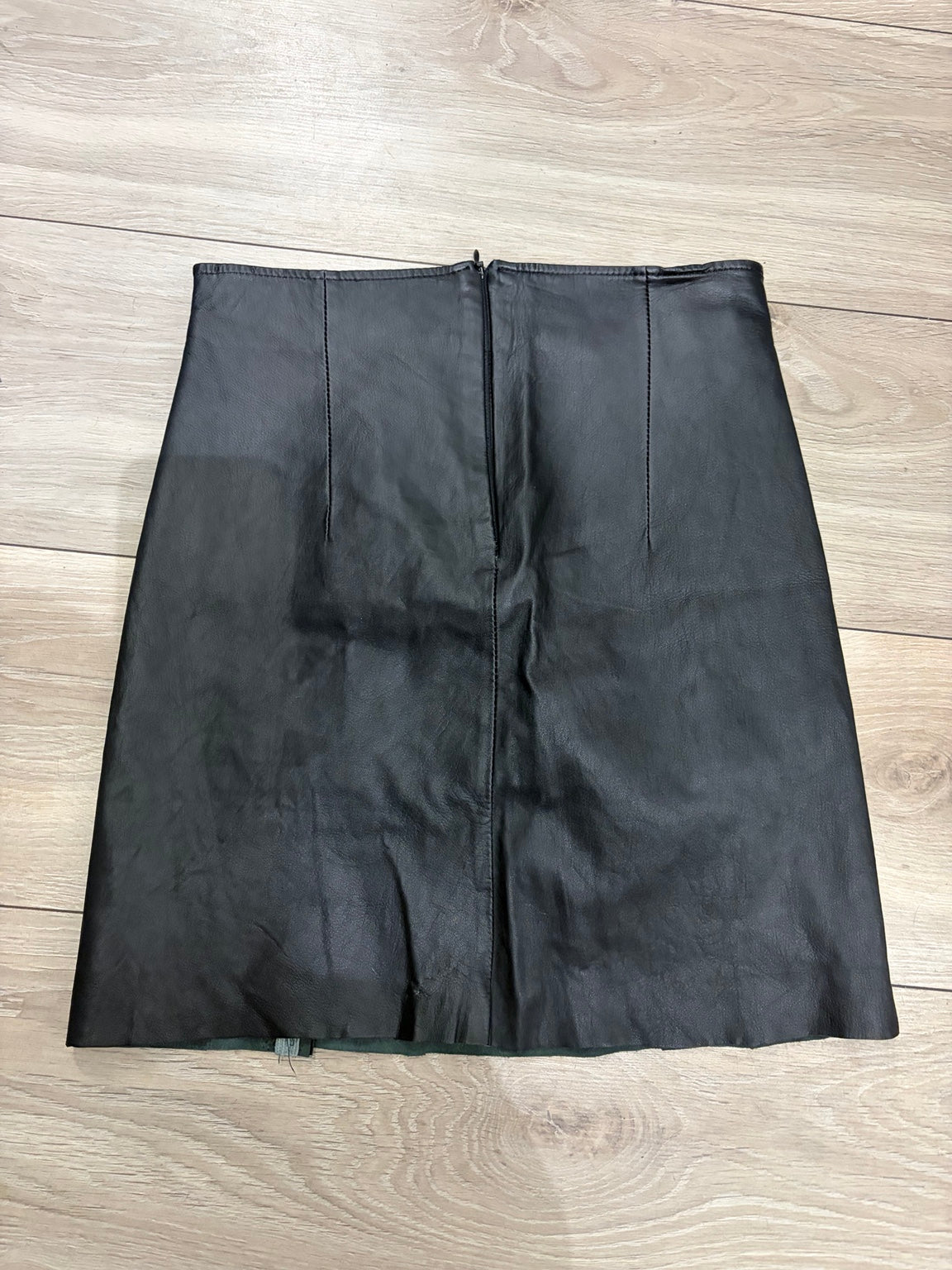 Black leather mini skirt back