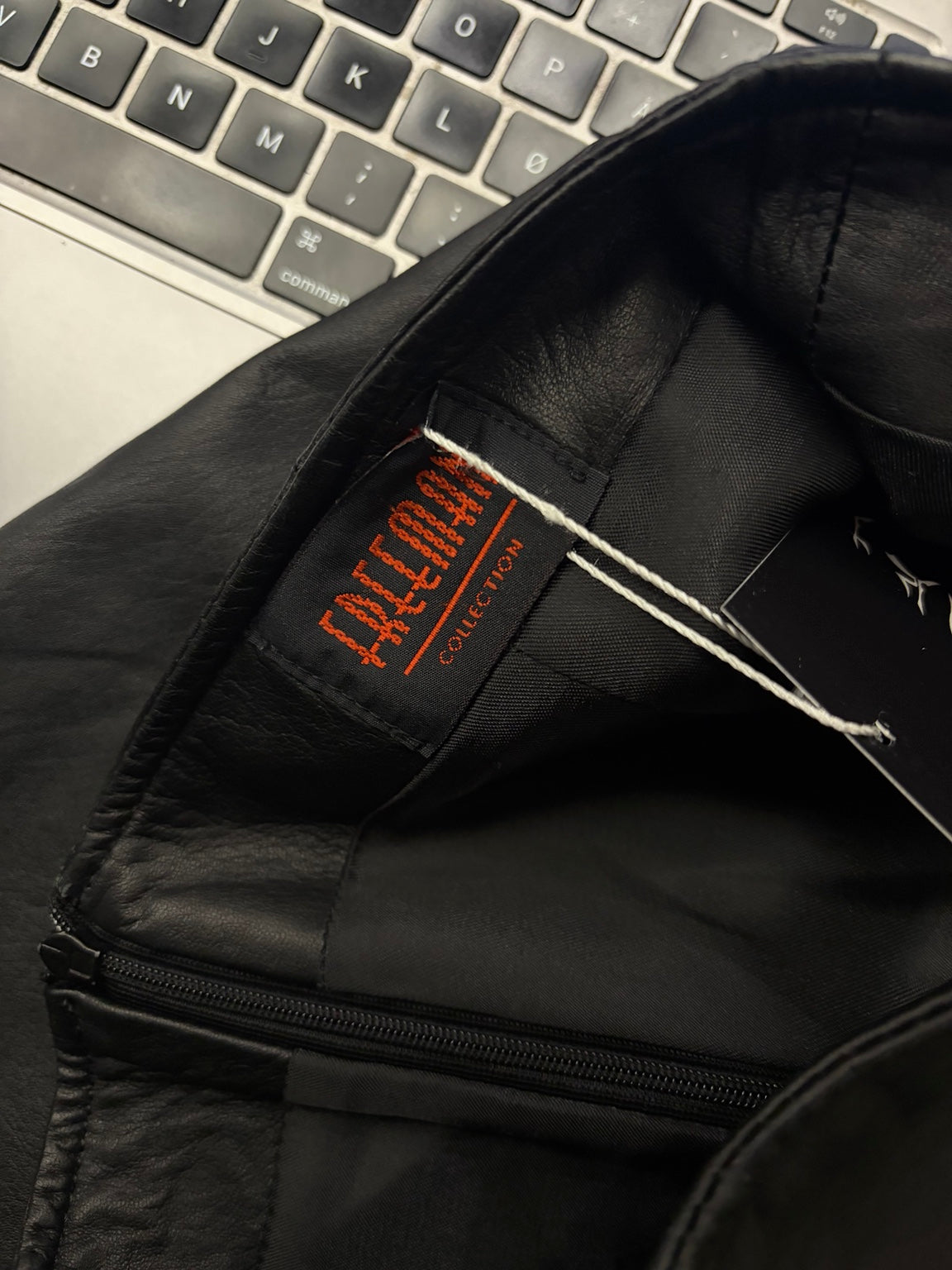 Black leather mini skirt label