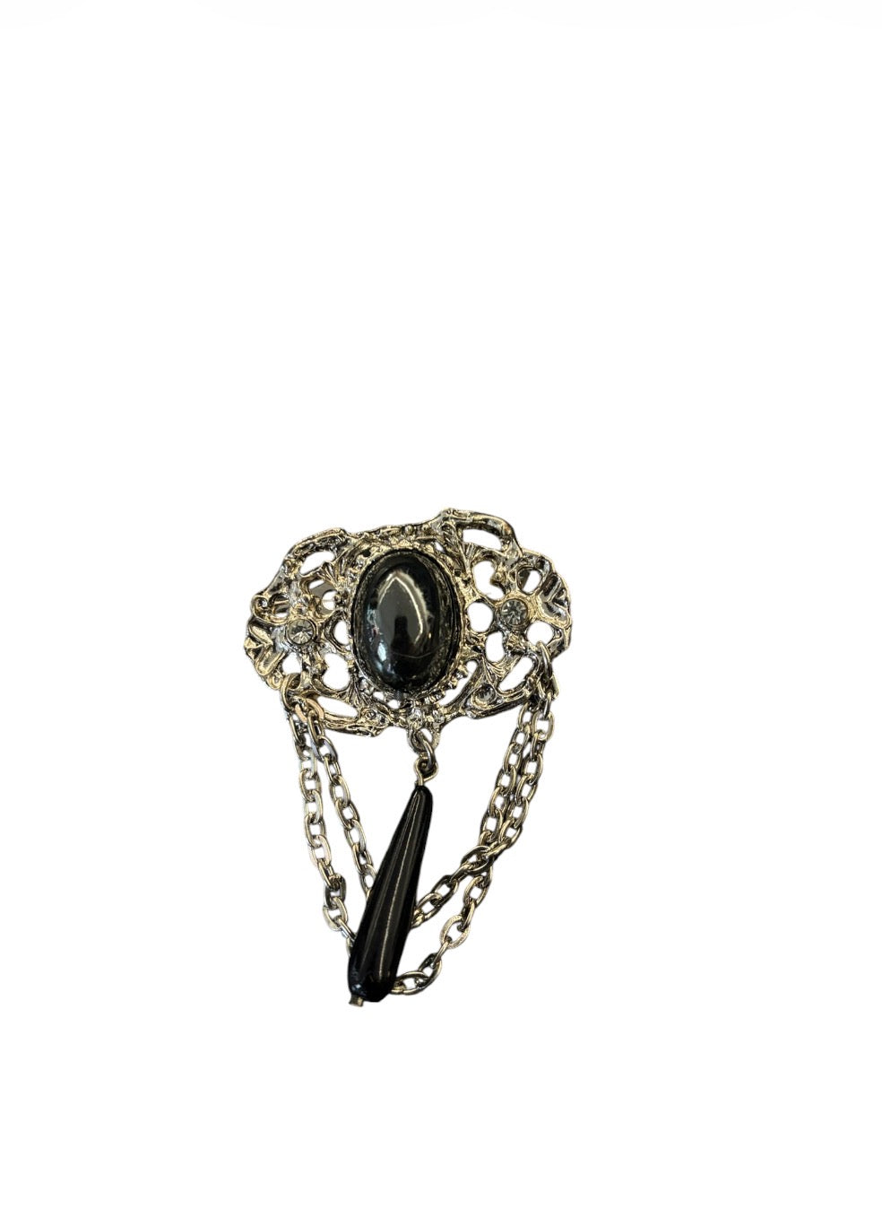 Silver-tone decorative brooch with oval black stone and dangling chains