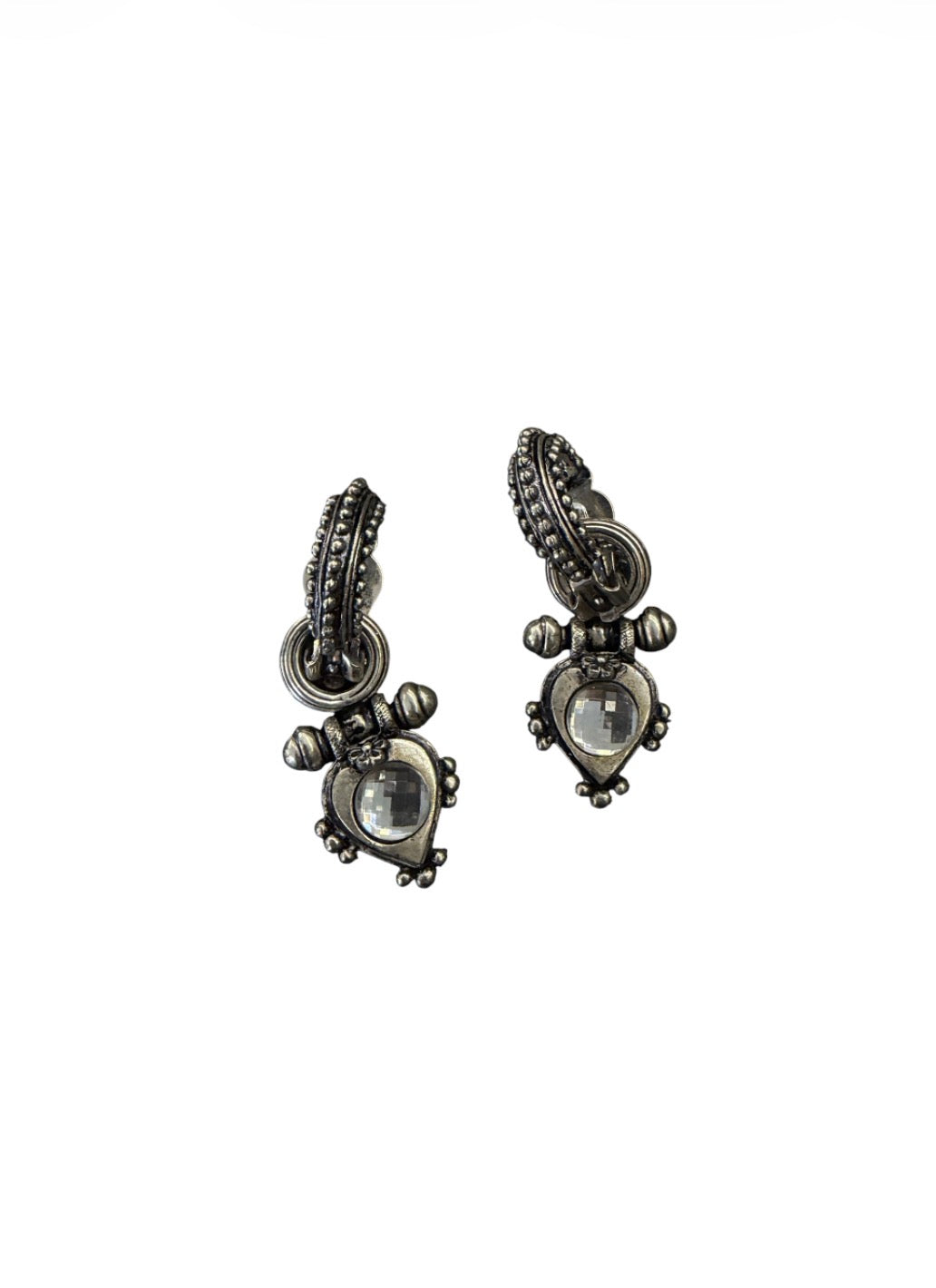 Silver-tone clip-on earrings with ornate detailing and clear faceted stones